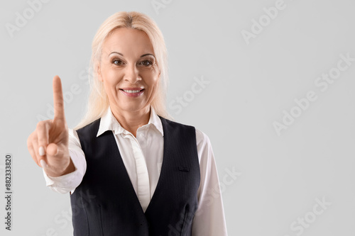 Mature businesswoman using ...
