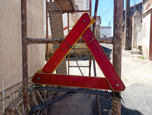 Car Warning Triangle fixed to the scaffold