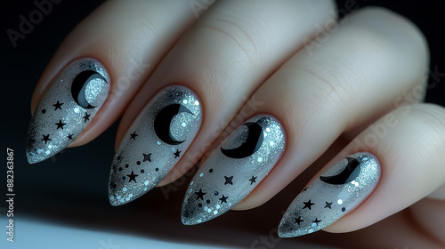 Velvet Night: These nails are painted a deep, velvety black, with a matte finish that exudes sophistication. Each nail is adorned with tiny, silver crescent moons and stars
