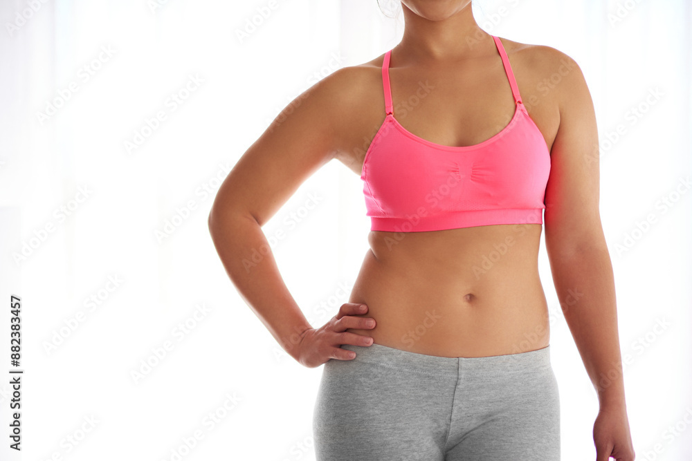 Hands, stomach and fitness for woman in studio by mock up space to lose weight by white background. Person, model and abdomen with sportswear for training, exercise or workout for body transformation Hands, stomach and fitness for woman in studio by mock up space to lose weight by white background. Person, model and abdomen with sportswear for training, exercise or workout for body transformation