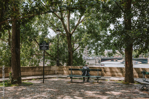 Man on Bench Along Seine