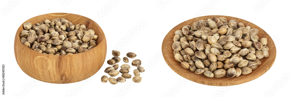 Hemp seeds in wooden bowl isolated on white background with full depth of field Hemp seeds in wooden bowl isolated on white background with full depth of field