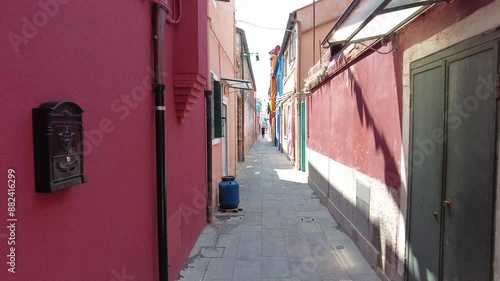 Narrow street in colorful Burano, Italy 