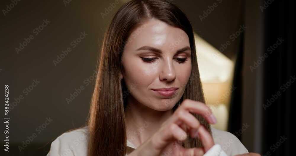 Close-up of young woman focusing on oral hygiene, ensuring braces stay clean and healthy. Smiling woman with dental braces cleaning teeth with dental floss at home. Orthodontic care and dental health Close-up of young woman focusing on oral hygiene, ensuring braces stay clean and healthy. Smiling woman with dental braces cleaning teeth with dental floss at home. Orthodontic care and dental health