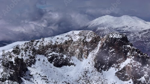 Aerial view of Ojos del Salado majestic peak of world's highest volcano Chile-Argentina border. Captured from air peak of Ojos del Salado stands highest volcano on Earth Chilean and Argentine border. photo