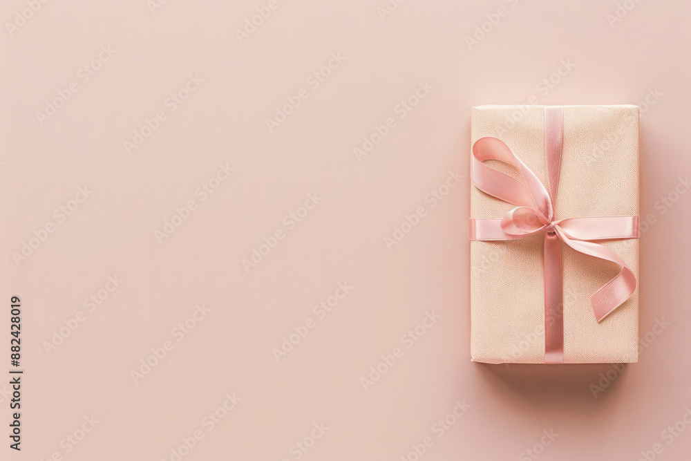A minimalist image featuring gift box on the right. The gift is wrapped in pastel paper with a ribbon bow, against a solid, neutral background with empty space on the left A minimalist image featuring gift box on the right. The gift is wrapped in pastel paper with a ribbon bow, against a solid, neutral background with empty space on the left