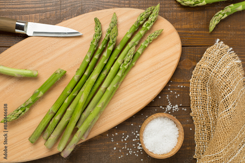 Fresh asparagus on wooden background, top view Fresh asparagus on wooden background, top view