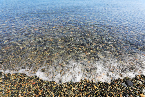 Summer view of clear water and wave on small pebbles at Jeongja Beach of Muryong-dong near Buk-gu, Ulsan, South Korea
 photo