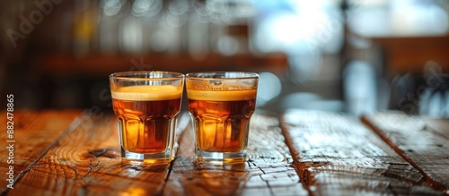 Two Glasses of Beer on a Wooden Table