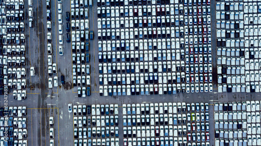 Aerial view cargo ship transportation of business logistic sea freight, New Cars produced by year up in the port for Cargo ship and Cargo import-export around in the world Aerial view cargo ship transportation of business logistic sea freight, New Cars produced by year up in the port for Cargo ship and Cargo import-export around in the world