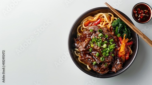 Jajangmyeon korean food with accompaniments in a black bowl with hand, looks delicious on a clean white background photo