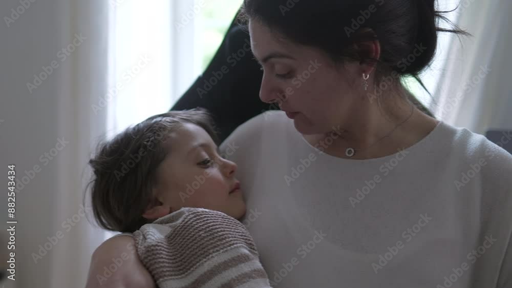 Mother kissing her child on the forehead, comforting him after he got hurt in the head, showing a tender and caring expression, capturing a heartwarming and intimate moment of maternal love Mother kissing her child on the forehead, comforting him after he got hurt in the head, showing a tender and caring expression, capturing a heartwarming and intimate moment of maternal love