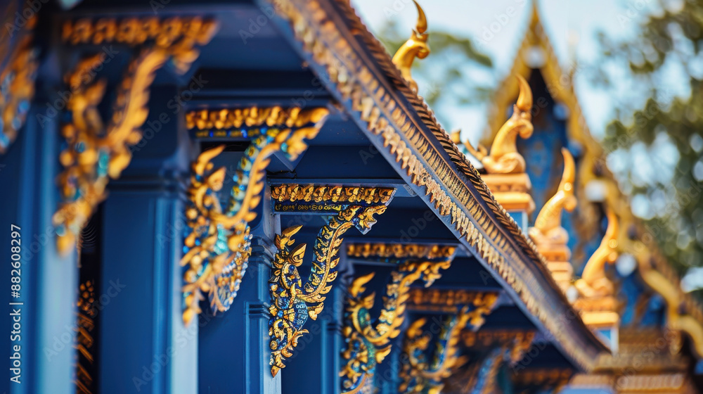 Obraz premium The intricate blue and gold details of Wat Ban Denâ€™s main hall, showcasing traditional Lanna architecture