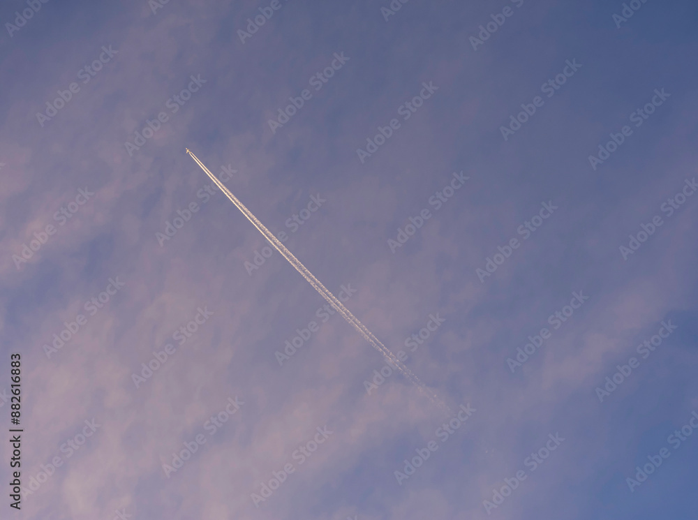A Jet plane flies high across the Australian sky.. A Jet plane flies high across the Australian sky..