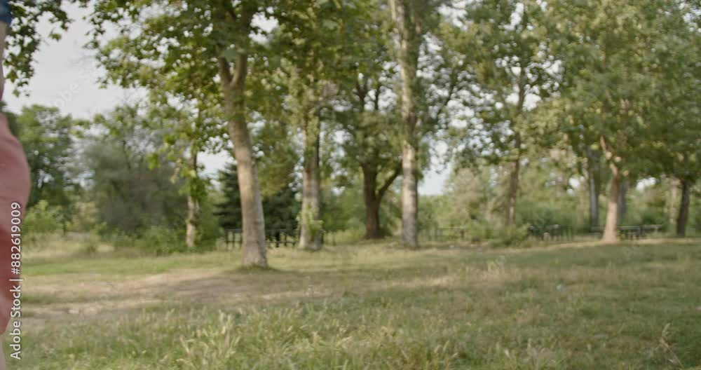Young woman taking a break, refreshing drink of water from a bottle while exercising outdoors in a natural environment. Young woman taking a break, refreshing drink of water from a bottle while exercising outdoors in a natural environment.