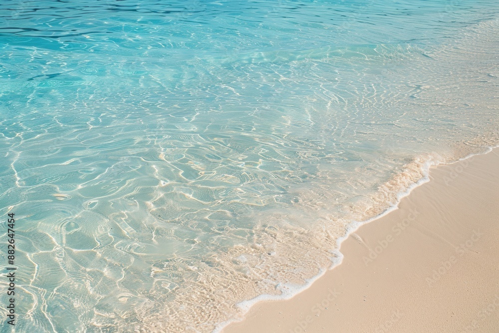 A beautiful beach with clear blue water and golden sand shoreline outdoors nature. A beautiful beach with clear blue water and golden sand shoreline outdoors nature.