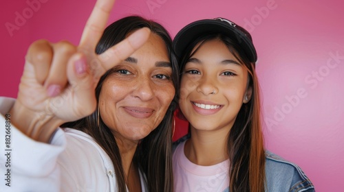 Love on the screen! Mother and daughter Latin-style vloggers pose together to...