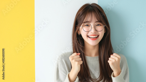 Wallpaper Mural Amazing excited fancy young Asian girl doing winner gesture celebrate clenching fists say yes isolated on plain colorful background Torontodigital.ca