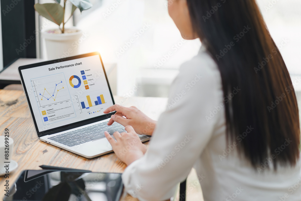 © PRIME STOCK LAB - Professional data analyst using data visualizations dashboard on computer monitor for data business analysis and Data Management System.