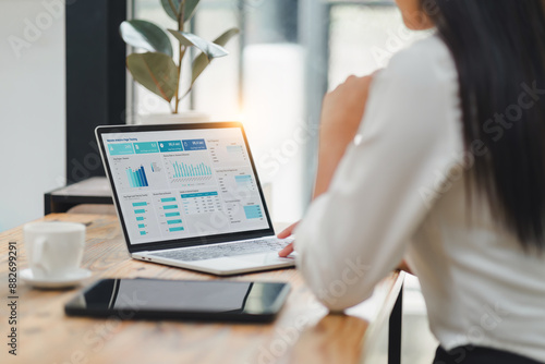 Fényképezés Professional data analyst using data visualizations dashboard on computer monitor for data business analysis and Data Management System
