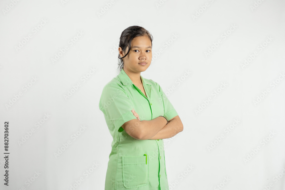 a young Asian nurse smiles and puts both hands in her shirt pockets, isolated on a white background
a young Asian nurse smiles and puts both hands in her shirt pockets, isolated on a white background