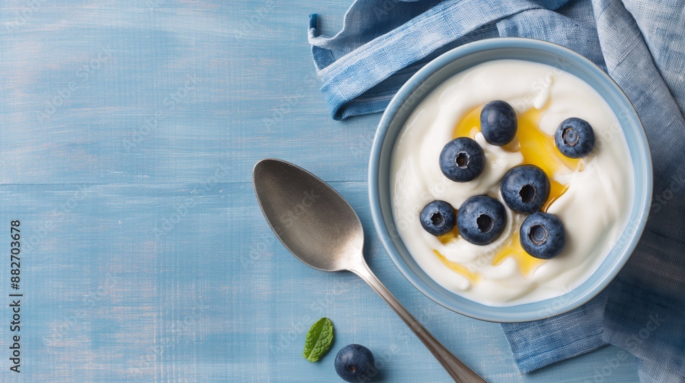 Food for convalescent patients, A bowl of plain yogurt with a spoonful of honey and a few blueberries Food for convalescent patients, A bowl of plain yogurt with a spoonful of honey and a few blueberries