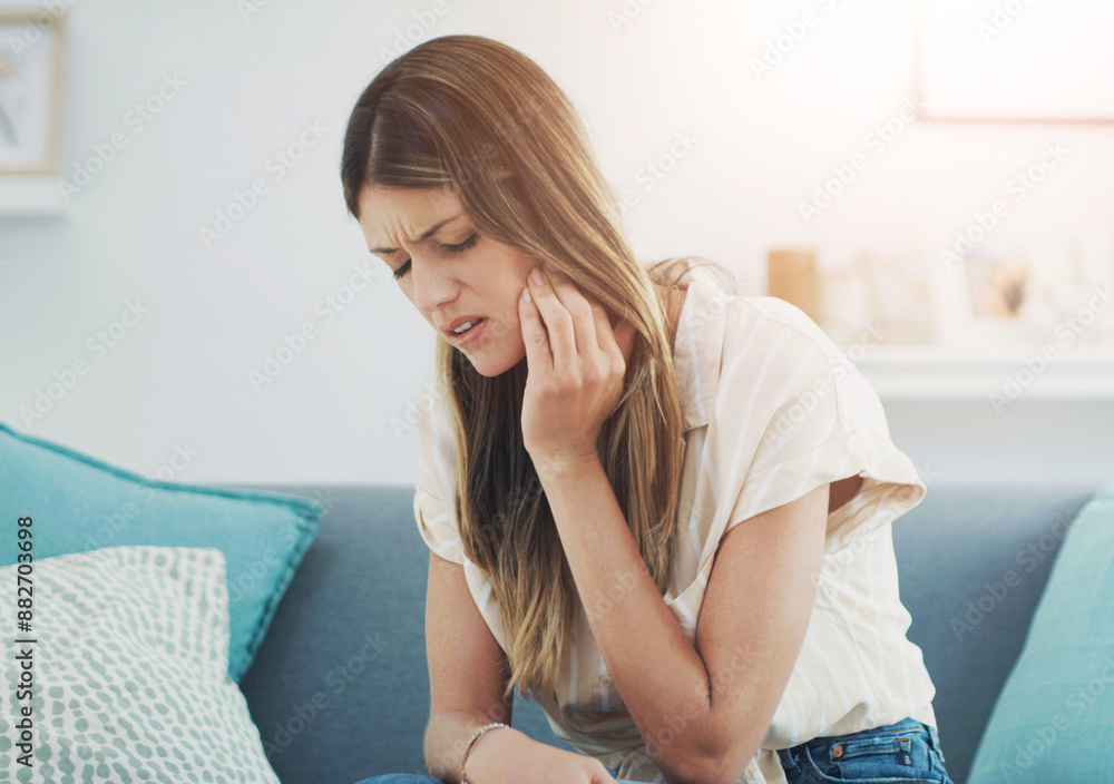 Home, sofa and woman with toothache or mouth in pain for dental problem and discomfort of cavity. Frustrated, sore and person with sensitive tooth for wisdom teeth, inflammation and oral infection Home, sofa and woman with toothache or mouth in pain for dental problem and discomfort of cavity. Frustrated, sore and person with sensitive tooth for wisdom teeth, inflammation and oral infection