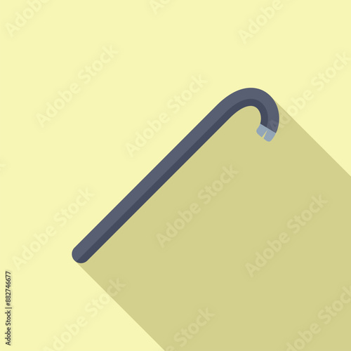 Crowbar is lying on a yellow background, casting a long shadow