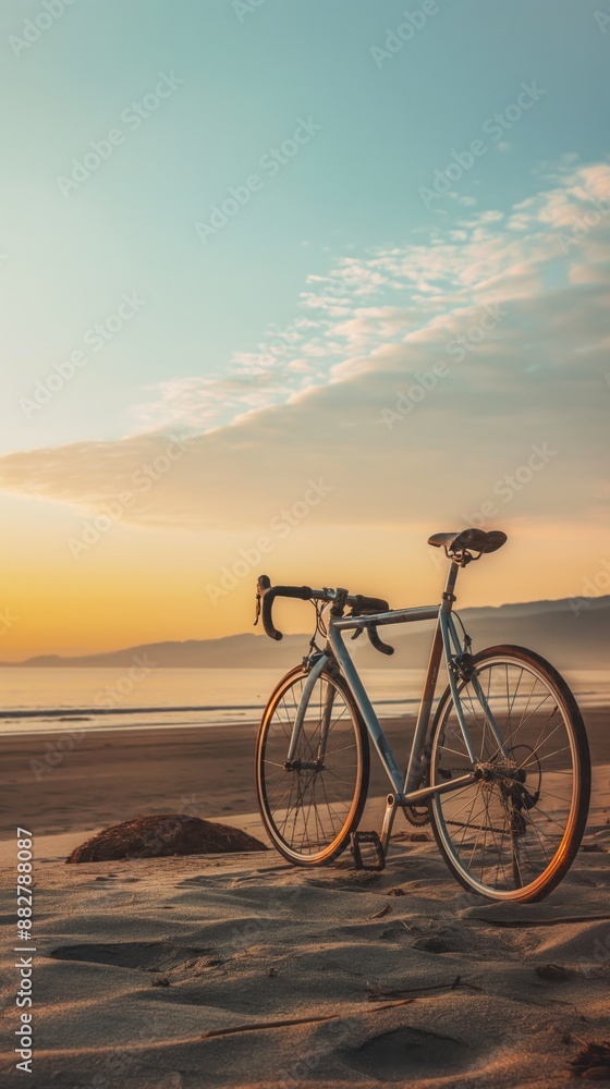 Bicycle parked on the beach with sunset Bicycle parked on the beach with sunset