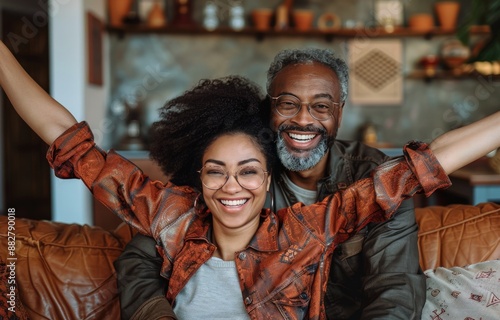 Excited Couple Celebrating Success Together at Home