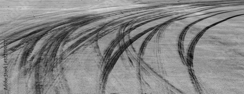 Obraz na płótnie Aerial view Textured background vehicle trace on asphalt road, Tire print texture background transport, Car tire mark burnout texture and background, Tire mark on the asphalt road race track. w salonie