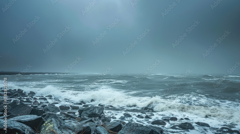 Obraz premium Climate change photo taken during high speed cyclonic winds gushing through the coastal region with heavy downpour taking place at horizon due to which it looks milky and rain approaching coast