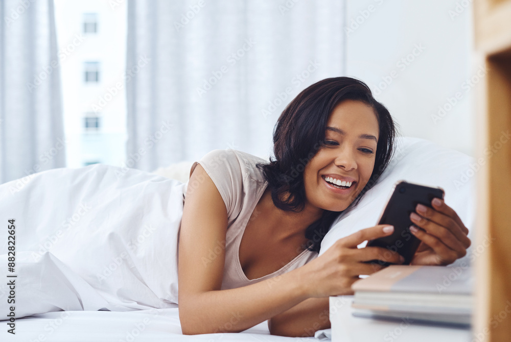 Woman, bedroom and happy morning with smartphone, home and silence mobile alarm in bed. Message, notification and text on social media, scrolling and weekend break for communication or reading blog Woman, bedroom and happy morning with smartphone, home and silence mobile alarm in bed. Message, notification and text on social media, scrolling and weekend break for communication or reading blog