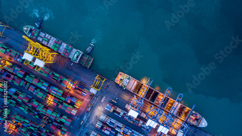 Obraz na płótnie Aerial view container cargo ship at commercial sea port, Global business logistic import export transportation international by container cargo ship, Container cargo ship freight shipping at night. w salonie