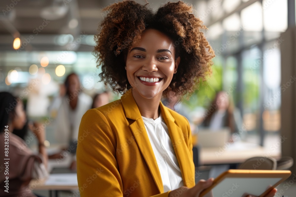 smiling woman with afro holding tablet smiling woman with afro holding tablet