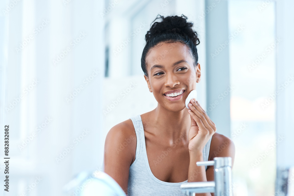 African woman, happy and skincare in mirror with cotton pads for routine at home. Natural, beauty and smile with confidence for transformation, facial and skin treatment in bathroom and satisfied African woman, happy and skincare in mirror with cotton pads for routine at home. Natural, beauty and smile with confidence for transformation, facial and skin treatment in bathroom and satisfied
