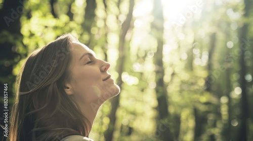 A young woman stands in a forest, eyes closed, breathing in the fresh air, bathed in the warm sunlight filtering through the trees.