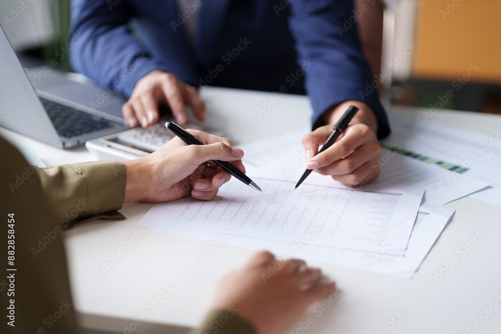 © STBSTD - Close-up of two individuals discussing and pointing at a document on a desk. The hands are holding pens, indicating a review or collaboration on the content of the document © STBSTD - Close-up of two individuals discussing and pointing at a document on a desk. The hands are holding pens, indicating a review or collaboration on the content of the document