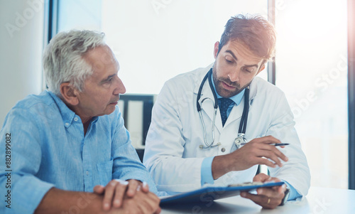 Obraz na plátně Hospital, doctor and men with clipboard in discussion for health insurance, feedback or planning