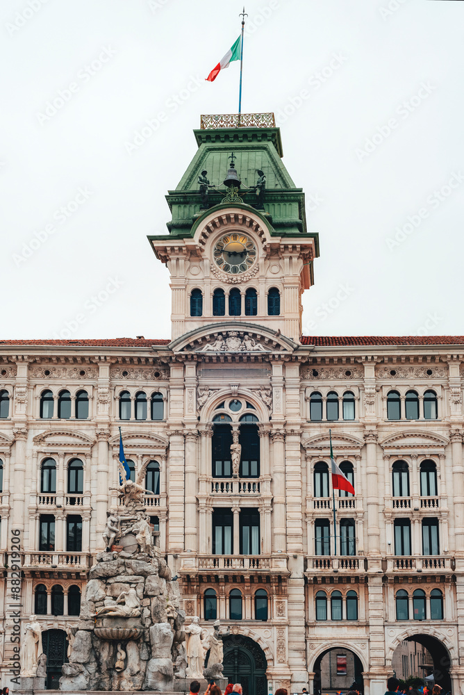 Obraz premium Trieste city hall and Fountain of the four continents at Piazza Unita d'Italia, Unity of Italy Square in Trieste, Italy