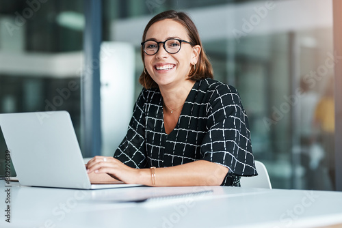 Slika na platnu Portrait, woman and typing in office with laptop for work as receptionist, administrative support and professional