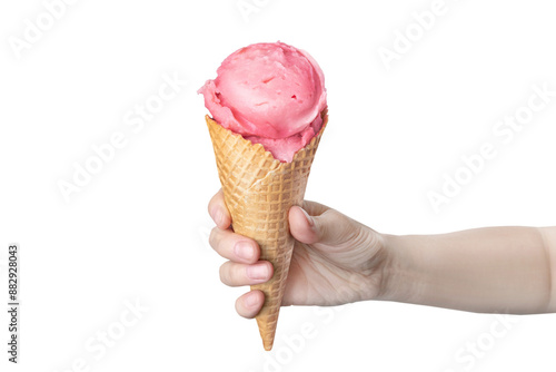 фотографія Woman's hand holding waffle cone with strawberry ice cream isolated on white or