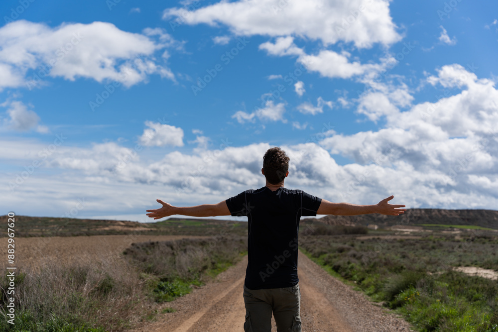 Man with open arms feeling freedom on the road. Man with open arms feeling freedom on the road.