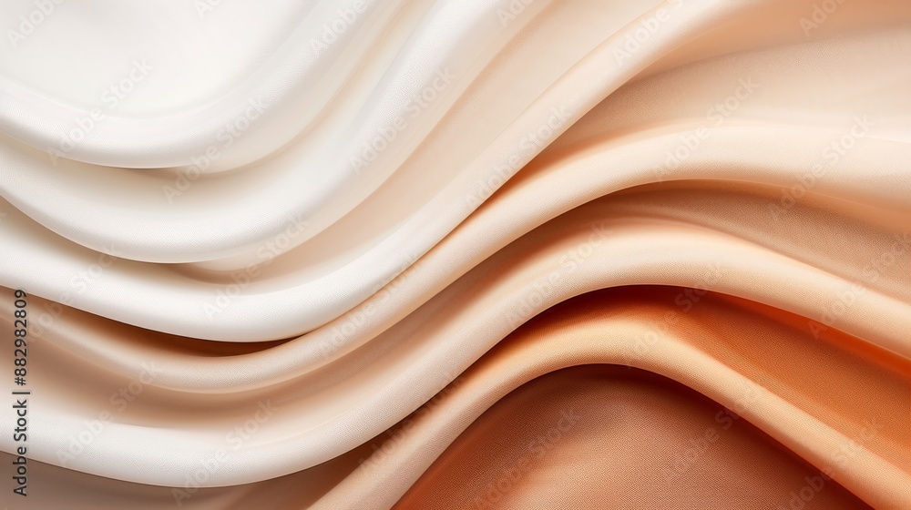 Obraz premium Close-up of smooth, flowing cream and beige fabric folds, showcasing delicate texture and elegant color transition. Perfect for design backgrounds.