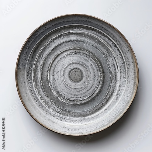 Trendy Beautiful Modern Circle Grey sand grain texture handmade Ceramic Dish plate, top view stoneware plate isolated white.