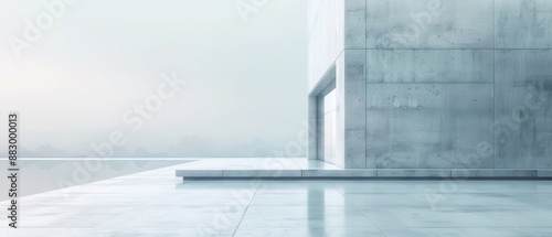 Modern minimalist concrete building exterior with reflective surface and cloudy sky  serene and peaceful architectural design.