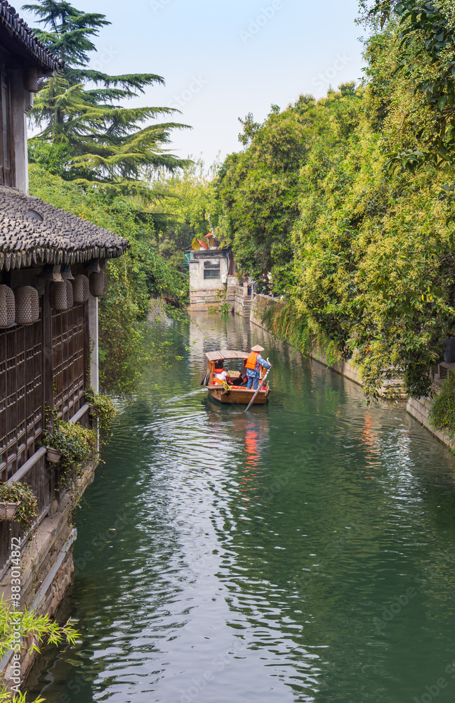 Wooden paddle boat on the canal in Suzhou, China
