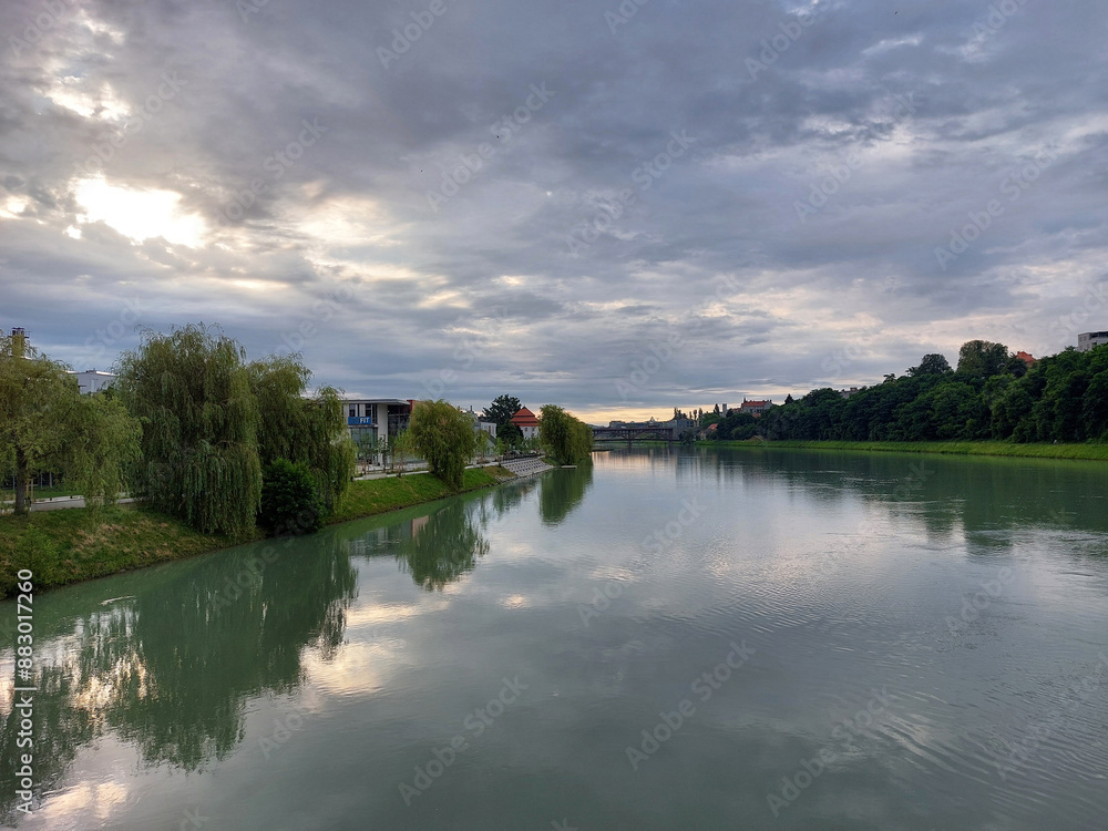 Fototapeta premium gray clouds over river Drava in Maribor in Europe. Overcast. Summer