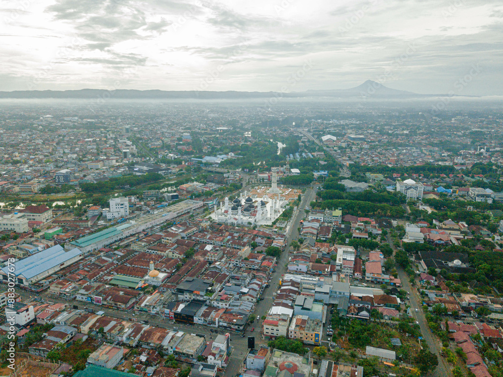 Fototapeta premium Aerial drone view of big city skyline scenery in Banda Aceh, Aceh, Indonesia.