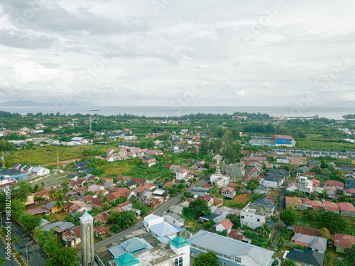 Aerial drone view of big city skyline scenery in Banda Aceh, Aceh, Indonesia. photo